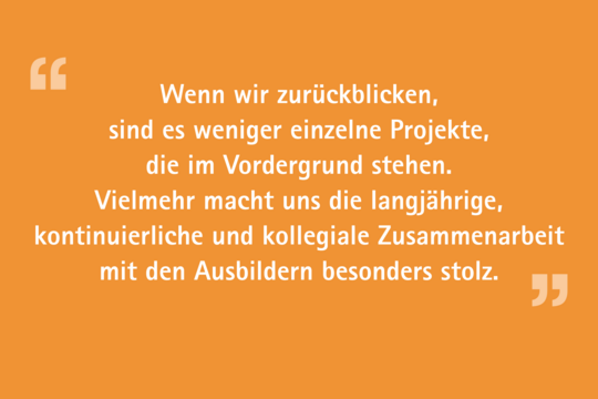 The image contains text on an orange background that discusses pride in long-term, collaborative work with trainers rather than focusing on individual projects. It emphasizes the value of continuous and collegial cooperation.